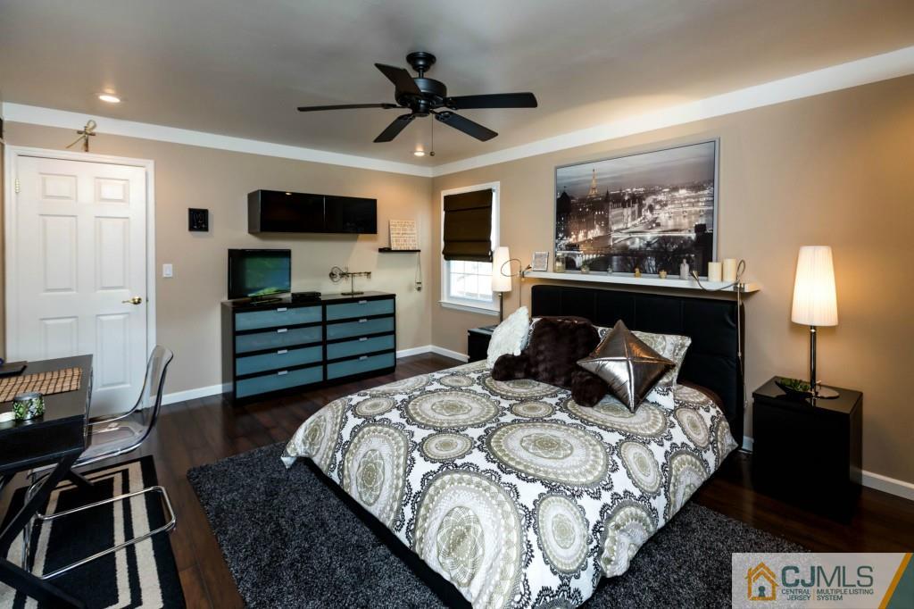 104 South Cliff Road Colonia, NJ 07067 - Photo 18 of 25 a bedroom with a bed and a television