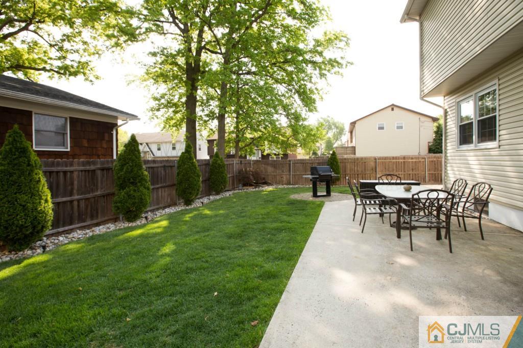 104 South Cliff Road Colonia, NJ 07067 - Photo 21 of 25 a view of a house with backyard and a sitting area