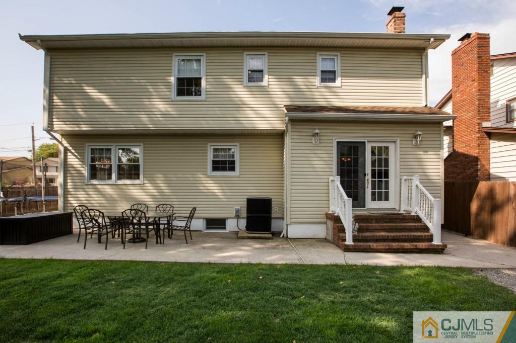 104 South Cliff Road Colonia, NJ 07067 - Photo 24 of 25 a front view of a house with a patio