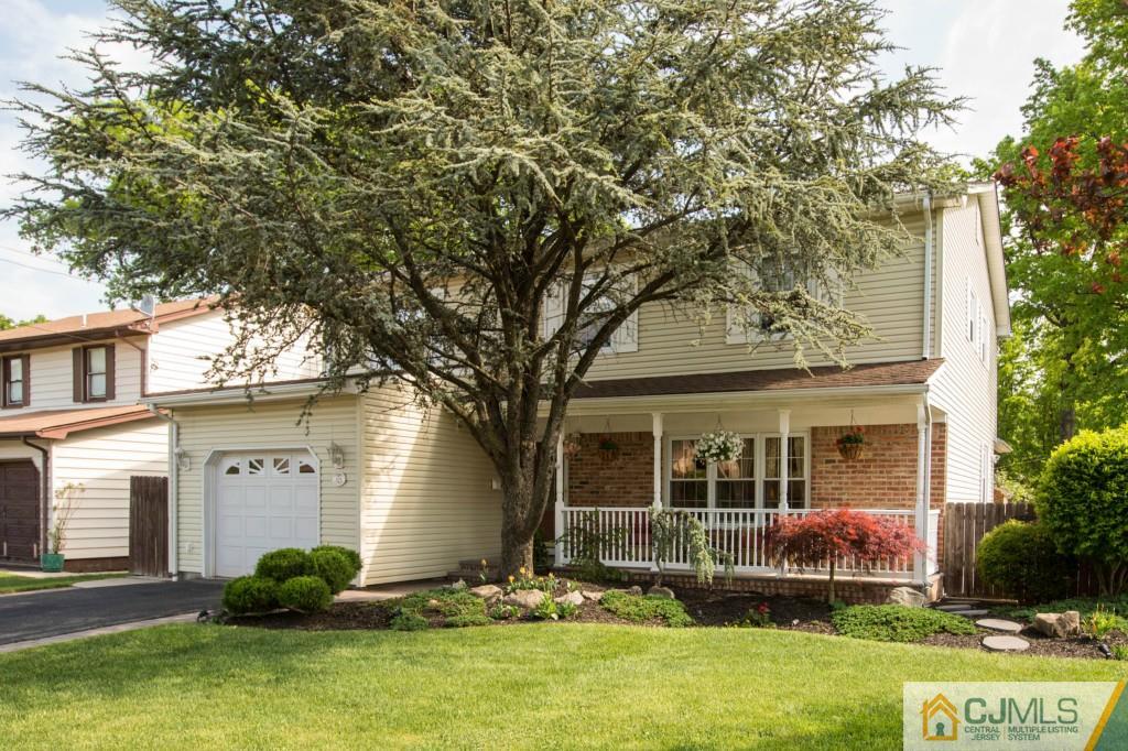 104 South Cliff Road Colonia, NJ 07067 - Photo 25 of 25 a front view of a house with garden