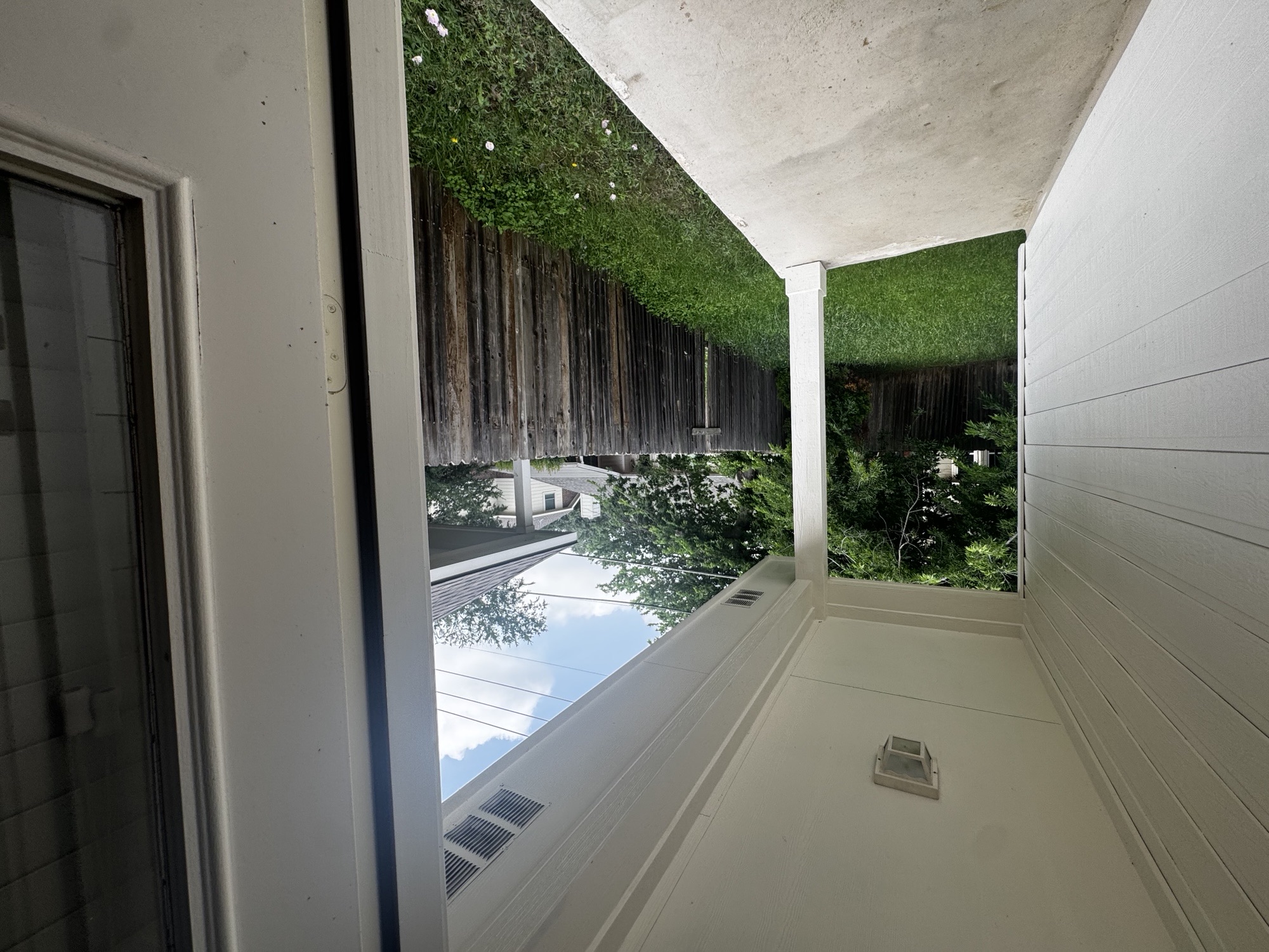 304 Valona Loop Round Rock, TX 78681 - Photo 13 of 15 Covered concrete patio featuring a ceiling light fixture, white siding, and a wooden privacy fence