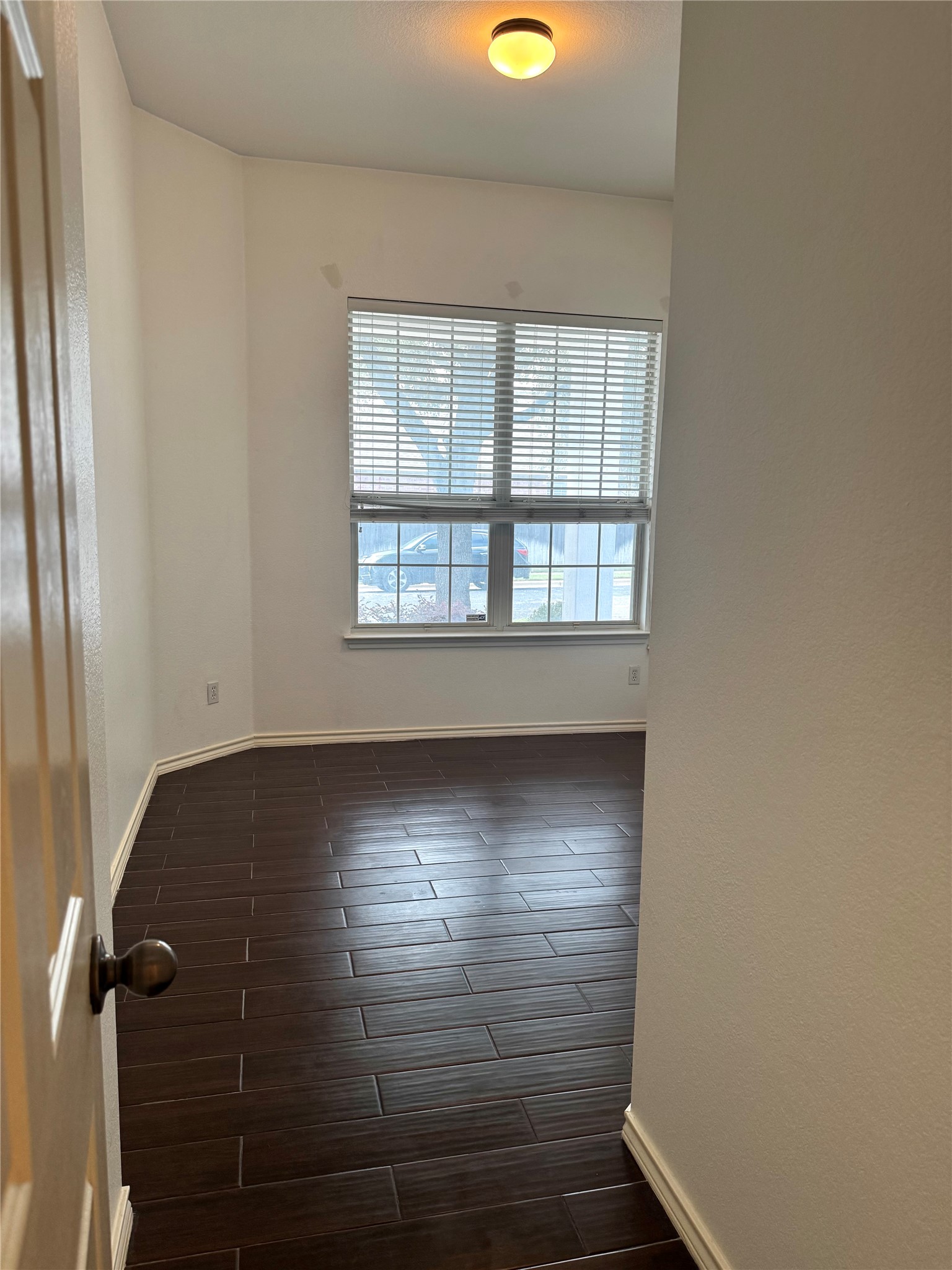 304 Valona Loop Round Rock, TX 78681 - Photo 4 of 15 Room featuring wood-finish tile flooring, a large window with blinds, and recessed lighting
