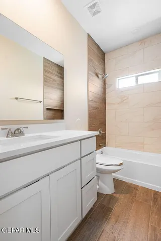 a bathroom with a toilet a sink and a bathtub
