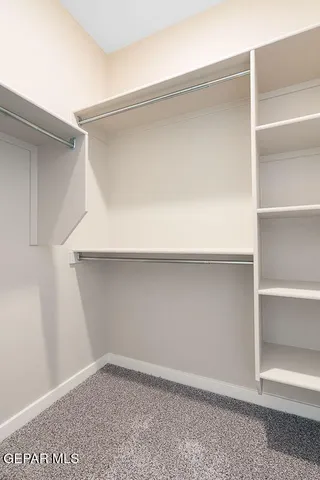 a view of an empty walk in closet
