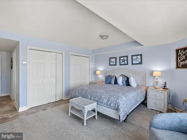 a bedroom with a bed and a couch