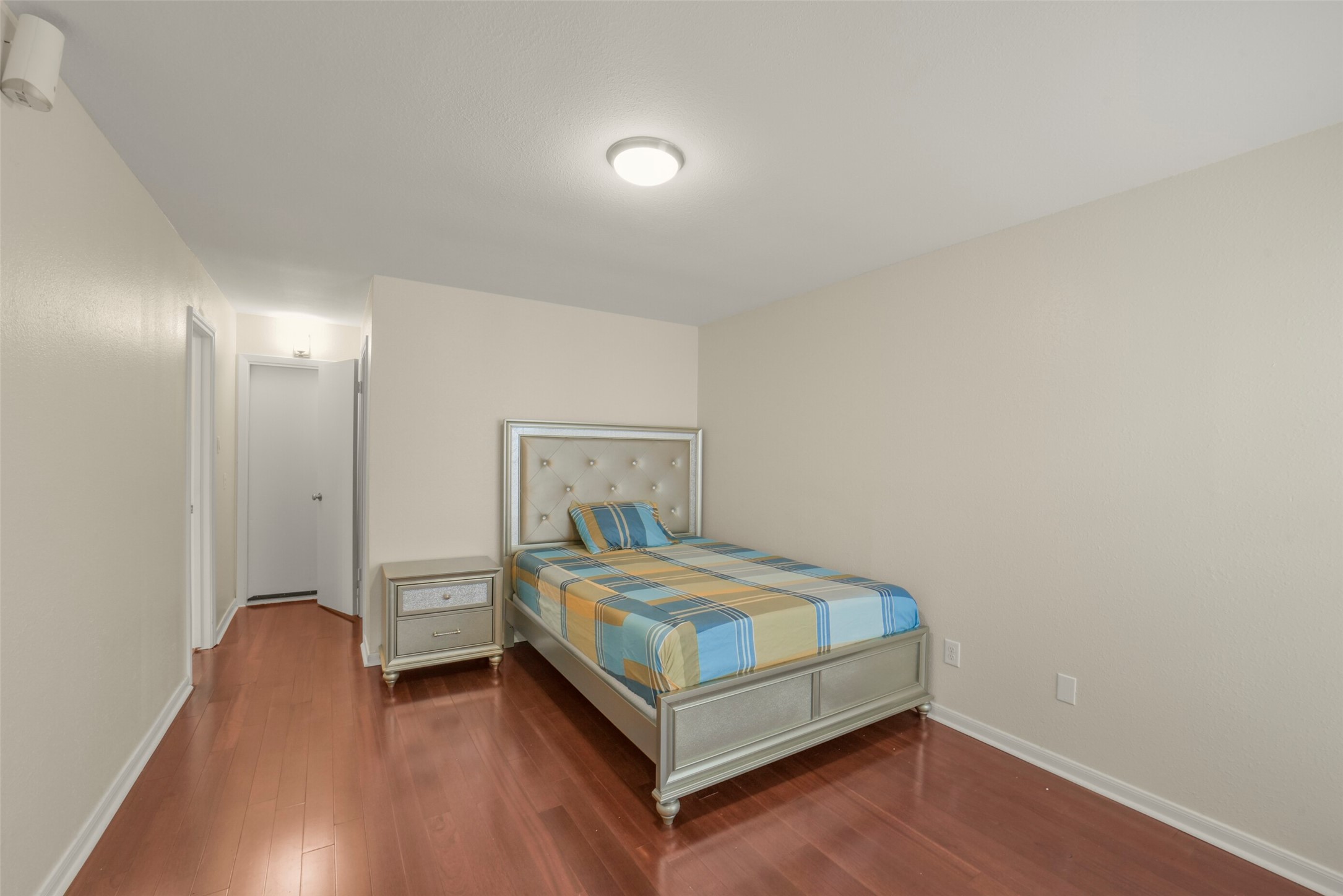 5707 Innsbruck Street Bellaire, TX 77401 - Photo 22 of 35 The primary bedroom boasts an ensuite bath, large walk-in closet, and direct garage access for convenience.