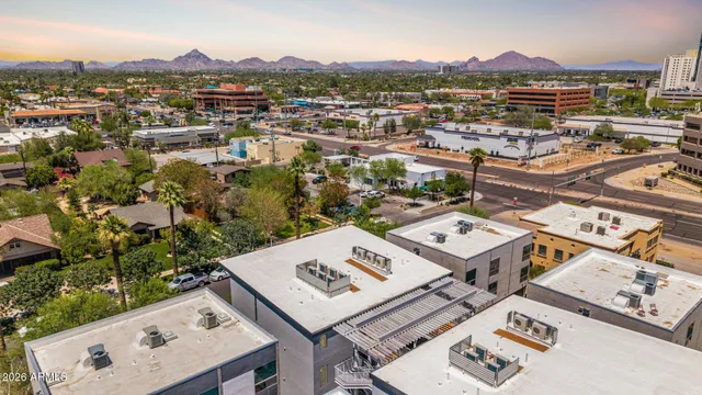 a view of a balcony dining table and chairs
