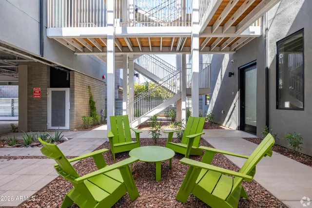 a view of an chairs and table in the patio