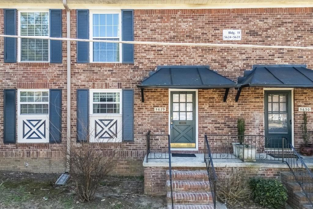 5629 Kingsport Drive, Unit 11 Atlanta, GA 30342 - Photo 32 of 52 a backyard of a house with seating space