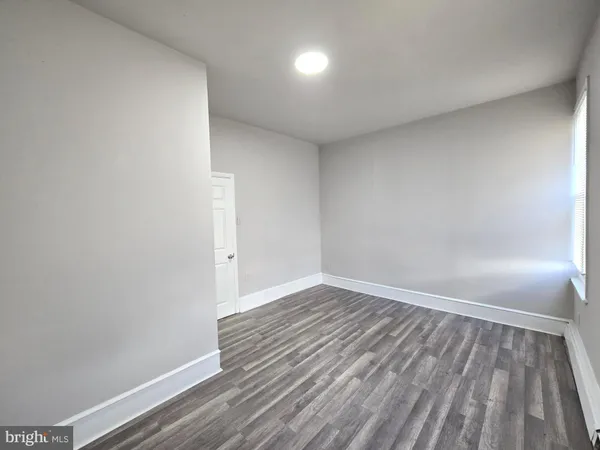 a view of wooden floor in an empty room