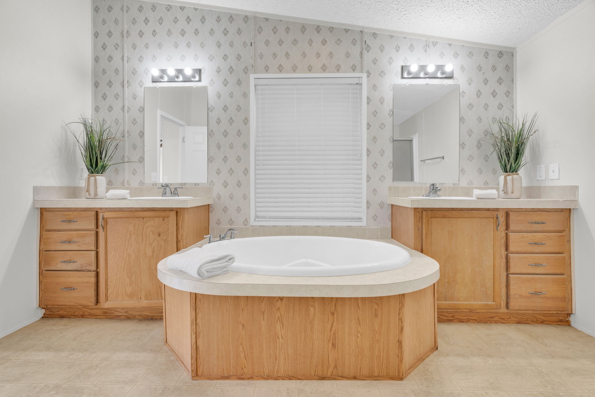 37038 Bell Road Waller, TX 77484 - Photo 18 of 33 a bathroom with a tub a sink and mirror