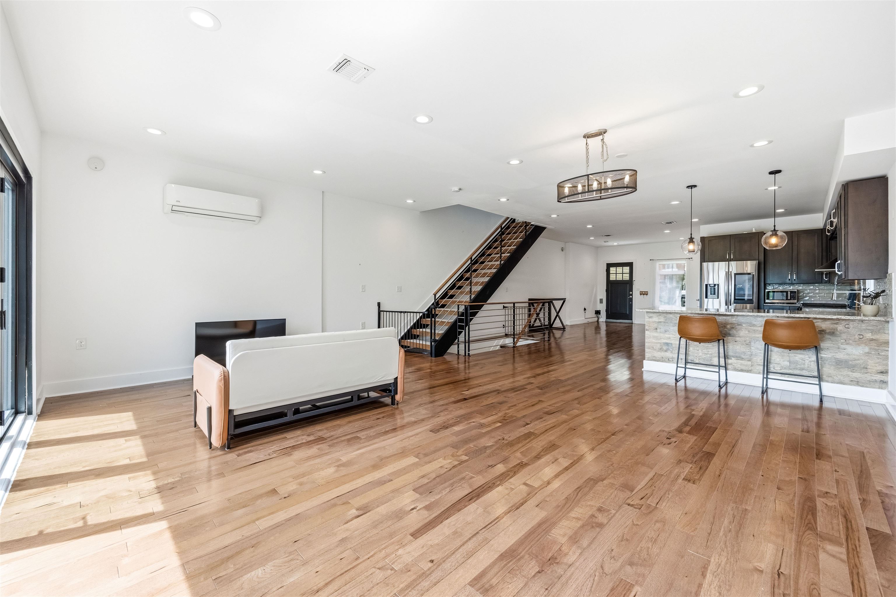 107 Mountain Road Jersey City, NJ 07307 - Photo 6 of 41 a living room with furniture and wooden floor
