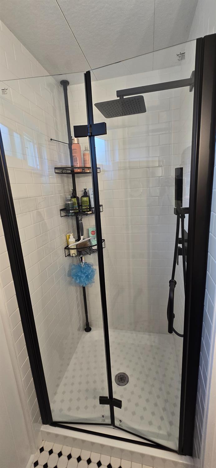22 Outer Circle Davis, CA 95618 - Photo 22 of 41 Tiled Shower with overhead rain shower head and handheld shower head.