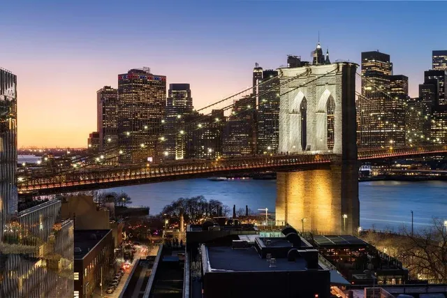 a view of a balcony with chairs and wooden floor