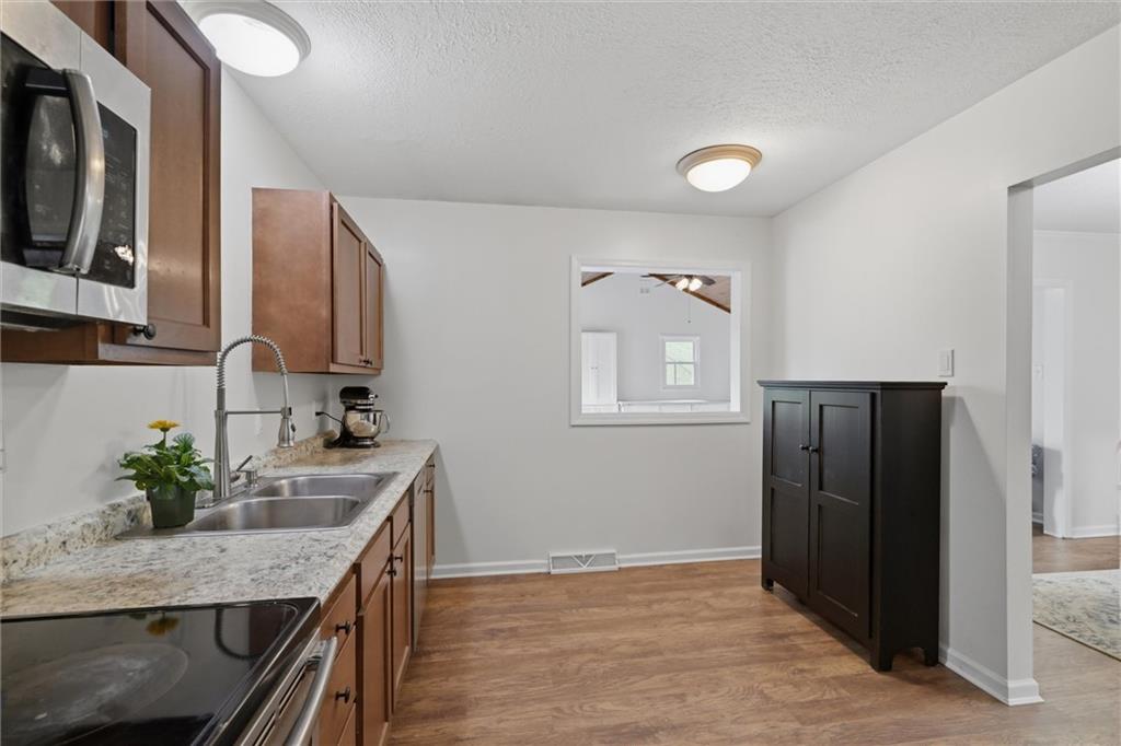 134 Stucky Road Renfrew, PA 16053 - Photo 12 of 32 a kitchen with stainless steel appliances granite countertop a refrigerator and a sink