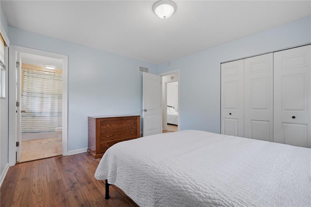 134 Stucky Road Renfrew, PA 16053 - Photo 13 of 32 a bedroom with a bed and wooden floor