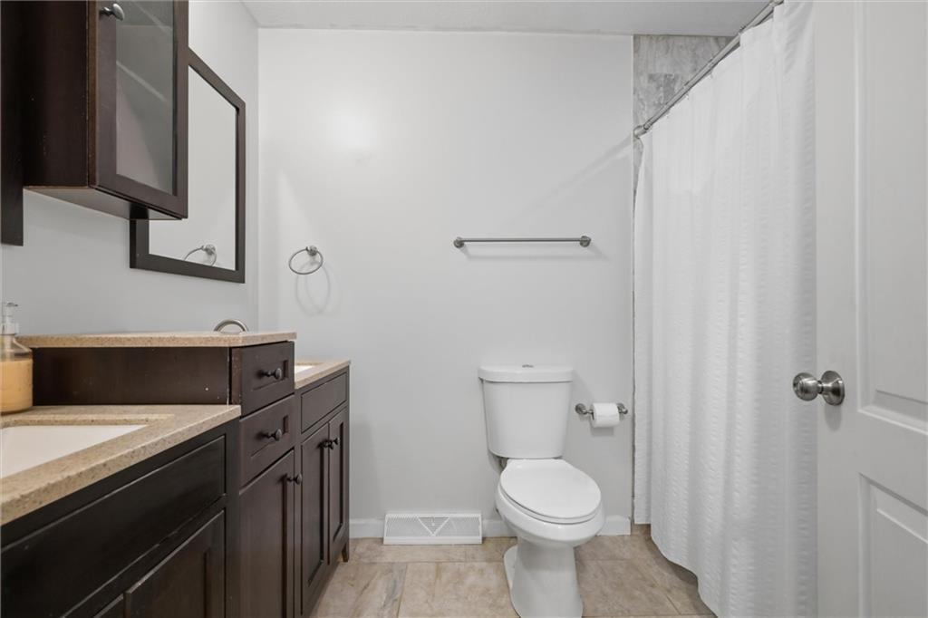 134 Stucky Road Renfrew, PA 16053 - Photo 18 of 32 a bathroom with a toilet sink and mirror