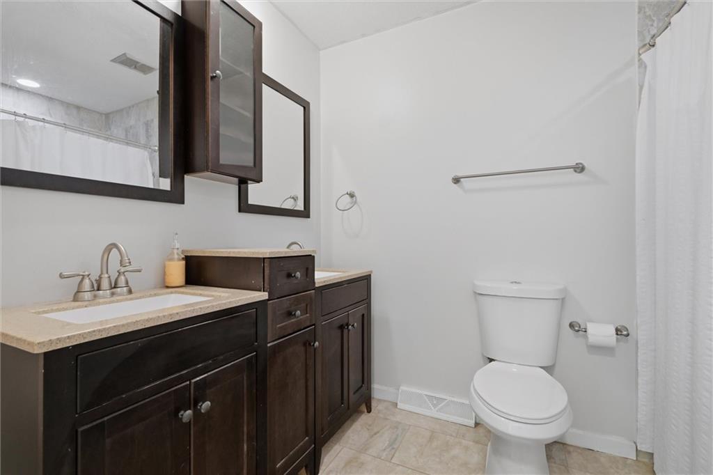 134 Stucky Road Renfrew, PA 16053 - Photo 19 of 32 a bathroom with a toilet sink and mirror
