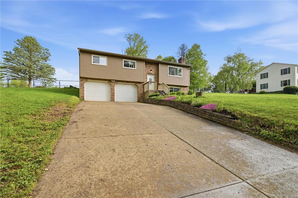 134 Stucky Road Renfrew, PA 16053 - Photo 22 of 32 a front view of a house with garden