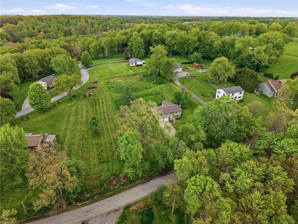 134 Stucky Road Renfrew, PA 16053 - Photo 29 of 32 a view of a garden with a building in the background