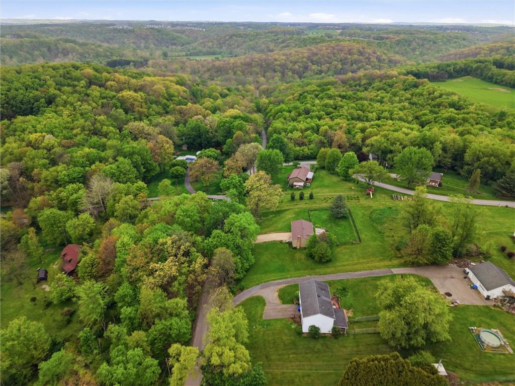134 Stucky Road Renfrew, PA 16053 - Photo 31 of 32 an aerial view of a houses with a lush green hillside