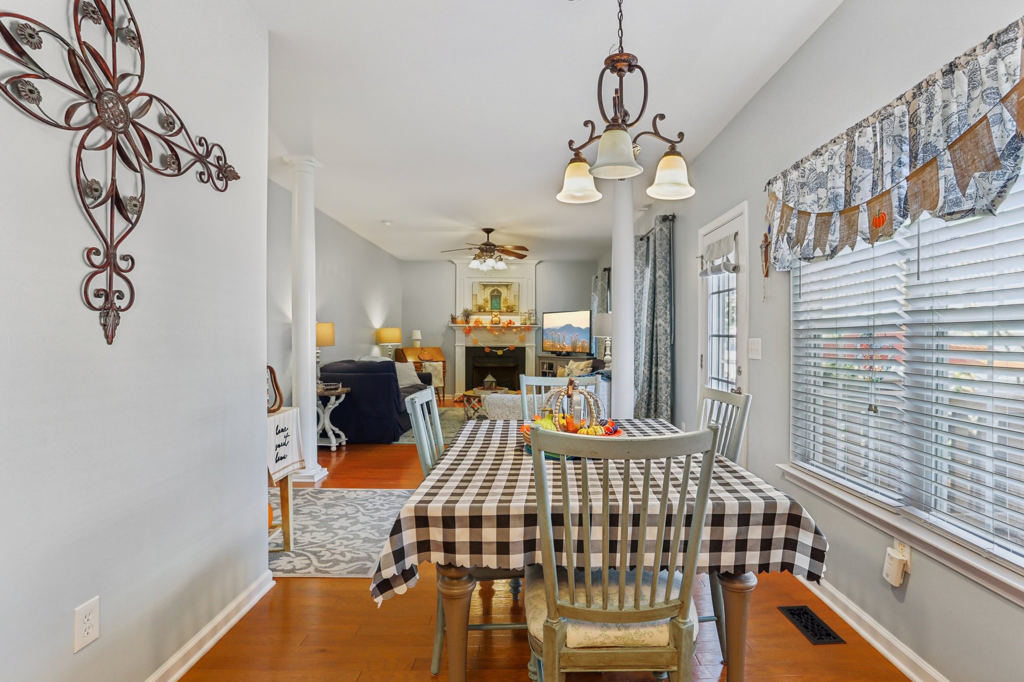 5017 Saunders Terrace Spring Hill, TN 37174 - Photo 16 of 52 a bedroom with a bed and a chandelier