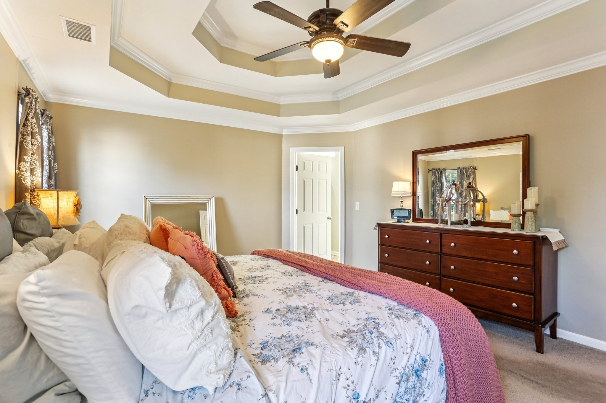5017 Saunders Terrace Spring Hill, TN 37174 - Photo 27 of 52 a bedroom with a bed and a chandelier
