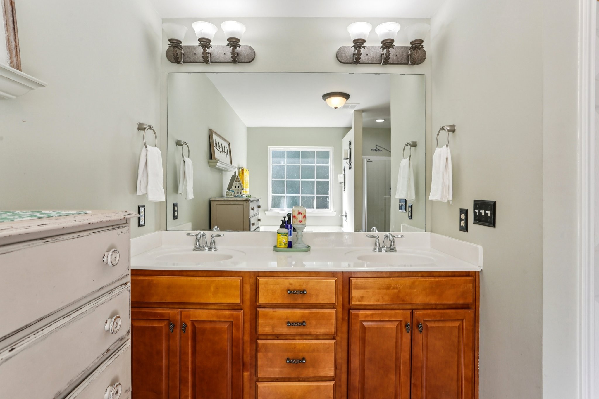 5017 Saunders Terrace Spring Hill, TN 37174 - Photo 31 of 52 a bathroom with a granite countertop sink and a mirror