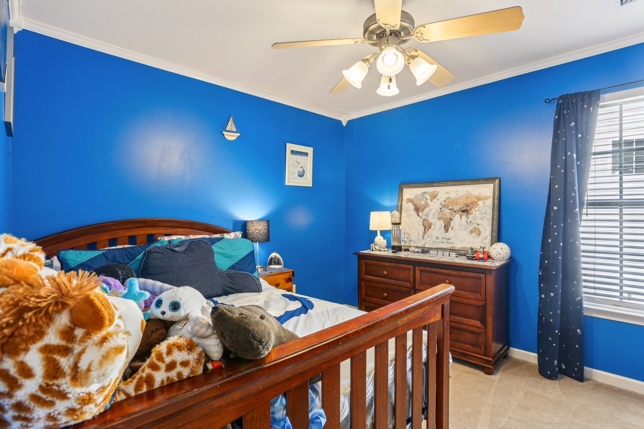 5017 Saunders Terrace Spring Hill, TN 37174 - Photo 37 of 52 a bedroom with two beds and a chandelier