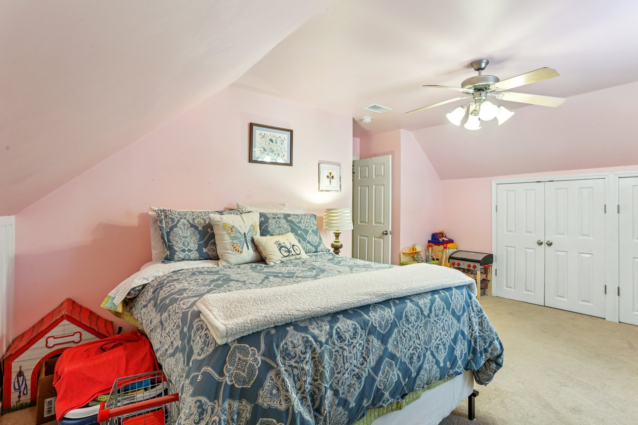 5017 Saunders Terrace Spring Hill, TN 37174 - Photo 40 of 52 a bedroom with a bed and a chandelier