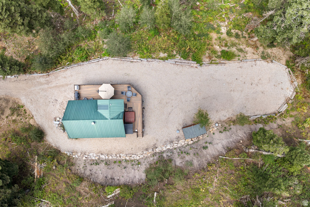 1782 Pine Loop Road Coalville, UT 84017 - Photo 52 of 52 Compact structure with a green metal roof and a wood-finish deck