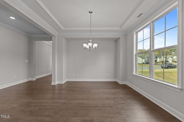 a kitchen with stainless steel appliances granite countertop a stove and a wooden floors