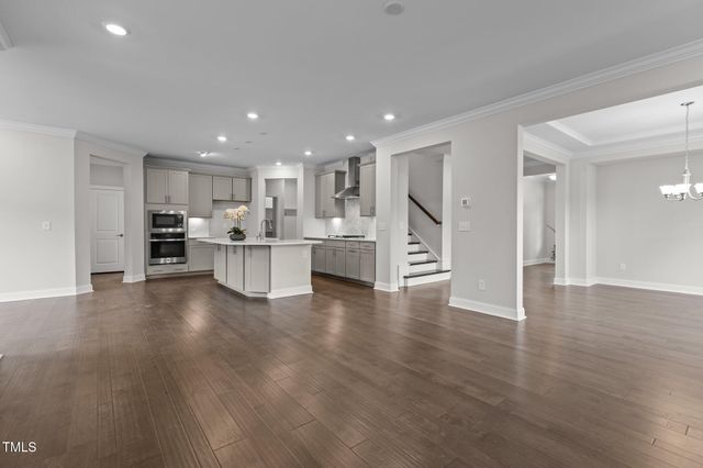a bathroom with a sink a mirror a toilet and shower