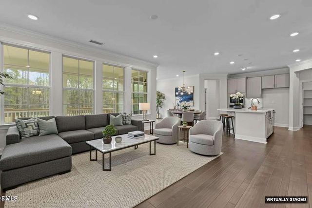 a kitchen with counter top space and wooden floor