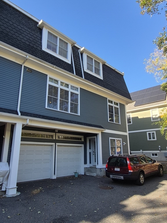 26 Dorr Street, Unit 26 Boston, MA 02119 - Photo 2 of 18 a car parked in front of a building