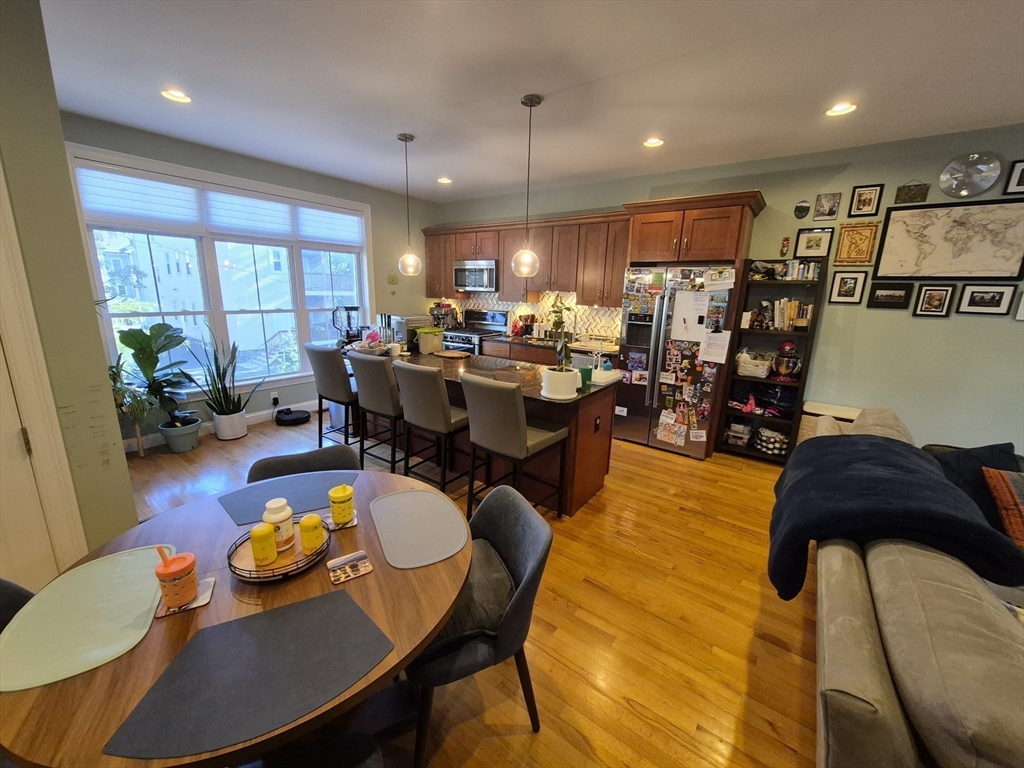 26 Dorr Street, Unit 26 Boston, MA 02119 - Photo 5 of 18 a view of a dining room with furniture window and wooden floor