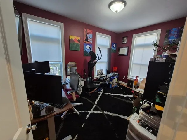 a room with furniture and musical instruments