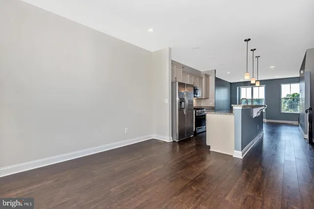 a view of a kitchen with wooden floor