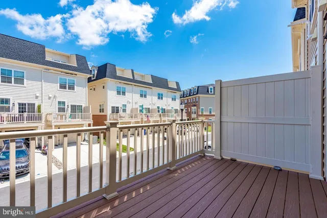 a view of a house with wooden deck