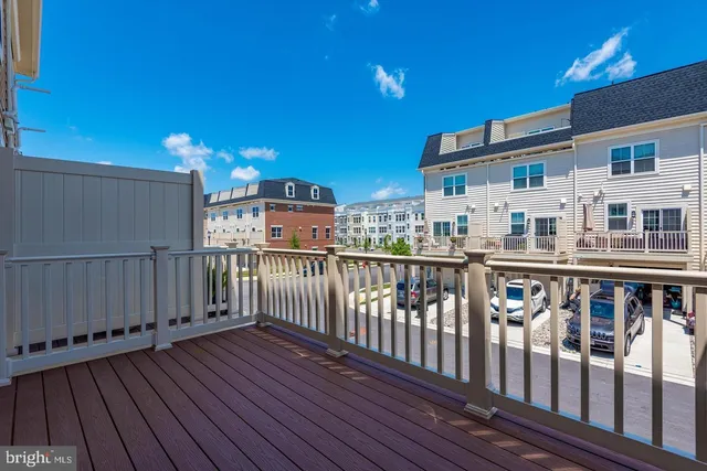 a view of a balcony with wooden floor