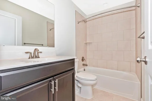 a bathroom with a sink a toilet and a bathtub