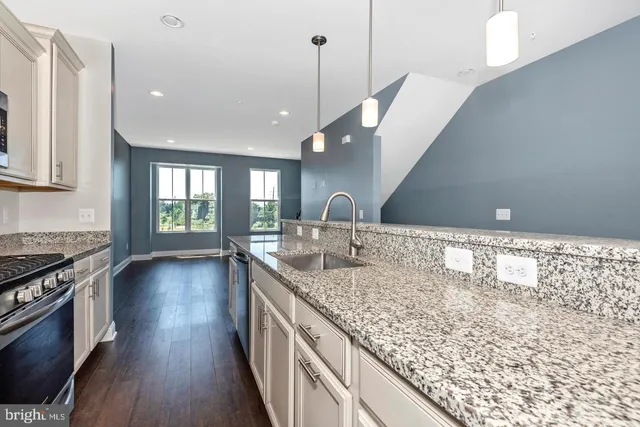 a kitchen with a sink and stove