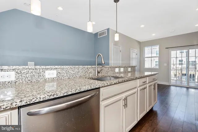 a kitchen with sink and window