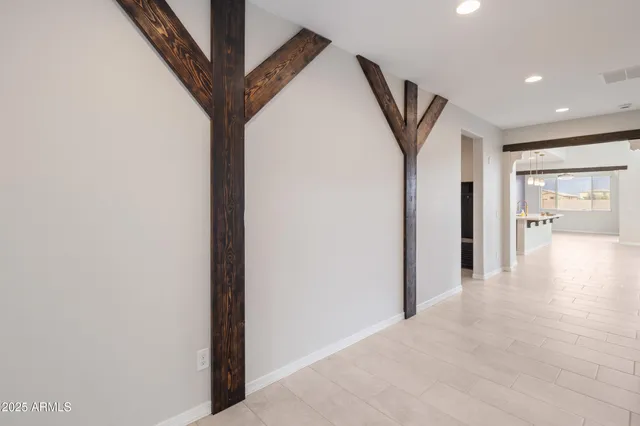 a view of an empty room and a window