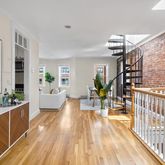 a view of a living room and entryway