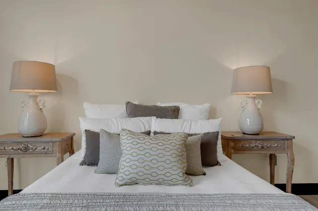 a living room with furniture and a lamp