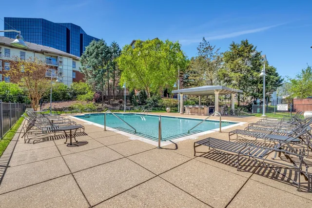 a view of a swimming pool with a patio