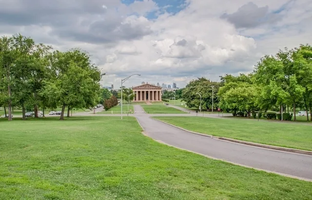 a view of a park and trees