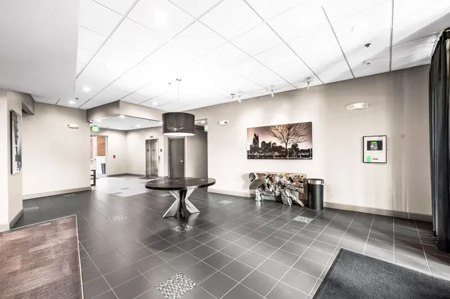 a lobby with furniture and wooden floor