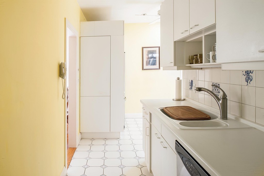82 Atherton Road, Unit 2 Brookline, MA 02446 - Photo 4 of 9 a kitchen with a sink and a refrigerator